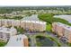 Expansive aerial view of condo buildings surrounded by lush greenery and serene lakes at 6450 Shoreline Dr Dr # 9202, St Petersburg, FL 33708