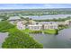 Aerial view of the condo buildings in a lush, green waterfront community near tranquil waterways at 6450 Shoreline Dr Dr # 9202, St Petersburg, FL 33708