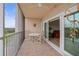 Tiled balcony with outdoor seating area, fan and lake views at 6450 Shoreline Dr Dr # 9202, St Petersburg, FL 33708
