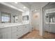 Bathroom with double sinks, quartz countertops, and access to a separate toilet room for added privacy at 6450 Shoreline Dr Dr # 9202, St Petersburg, FL 33708