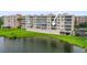 Condo building with parking area overlooking a pond at 6450 Shoreline Dr Dr # 9202, St Petersburg, FL 33708