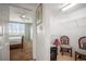 View from the hallway leading to a bedroom and closet space with wire shelving and seating at 6450 Shoreline Dr Dr # 9202, St Petersburg, FL 33708