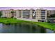Lakefront condo offers scenic views, with serene water, and a well-maintained lawn at 6450 Shoreline Dr Dr # 9202, St Petersburg, FL 33708