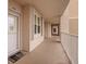 Exterior hallway of a building, showing door and window with natural light at 6450 Shoreline Dr Dr # 9202, St Petersburg, FL 33708