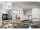 Bright kitchen features white cabinetry, stainless steel appliances, and granite countertops at 6450 Shoreline Dr Dr # 9202, St Petersburg, FL 33708