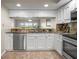 Bright kitchen features stainless steel appliances and white cabinetry at 6450 Shoreline Dr Dr # 9202, St Petersburg, FL 33708