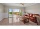 Inviting living room with access to a screened-in lanai and tile floors at 6450 Shoreline Dr Dr # 9202, St Petersburg, FL 33708