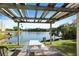 Picnic table in the shade overlooking a serene lake at 6450 Shoreline Dr Dr # 9202, St Petersburg, FL 33708