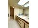 Bathroom featuring a skylight, vanity area and tiled floors at 9578 121St St, Seminole, FL 33772