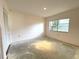 Bedroom featuring light walls, a closet, and a bright window at 9578 121St St, Seminole, FL 33772