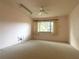Bedroom featuring a ceiling fan, window, and neutral carpeting at 9578 121St St, Seminole, FL 33772