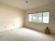Empty room featuring neutral carpeting and bright window views at 9578 121St St, Seminole, FL 33772