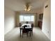 Dining room with a large window, a ceiling fan, and a dining table at 9578 121St St, Seminole, FL 33772