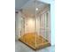 Foyer with hardwood floors, decorative railing and closet space at 9578 121St St, Seminole, FL 33772