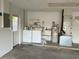 Garage with appliances and door leading to outdoors at 9578 121St St, Seminole, FL 33772