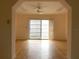 Open living room featuring hardwood floors and sliding glass doors with bright light at 9578 121St St, Seminole, FL 33772