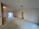 A spacious living room with neutral-toned walls and a ceiling fan at 9578 121St St, Seminole, FL 33772