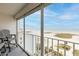 Relaxing balcony with comfortable seating and panoramic views of the beach at 11000 Gulf Blvd # 1002, Treasure Island, FL 33706