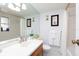 Bright bathroom features a vanity with storage, a large mirror, and a shower/tub combo at 11000 Gulf Blvd # 1002, Treasure Island, FL 33706
