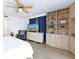 This bedroom features built-in shelving, a ceiling fan, and an adjacent sitting area at 11000 Gulf Blvd # 1002, Treasure Island, FL 33706