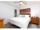 Well-lit bedroom with wood floors, large bed, and decorative nautical accents at 11000 Gulf Blvd # 1002, Treasure Island, FL 33706
