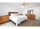 Cozy bedroom with light-colored floors, a large bed, dressers, and soft lamps at 11000 Gulf Blvd # 1002, Treasure Island, FL 33706
