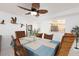 Cozy dining room with a table set for six, natural light, and contemporary decor at 11000 Gulf Blvd # 1002, Treasure Island, FL 33706