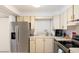 Charming kitchen boasts stainless steel appliances and a bright window over the sink at 11000 Gulf Blvd # 1002, Treasure Island, FL 33706
