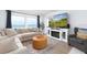 Comfortable living room with large windows boasting stunning beach views at 11000 Gulf Blvd # 1002, Treasure Island, FL 33706
