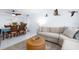 Open-concept living and dining area with beach views, neutral tones and coastal accents at 11000 Gulf Blvd # 1002, Treasure Island, FL 33706