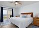 Comfortable main bedroom offers balcony access and beautiful natural light at 11000 Gulf Blvd # 1002, Treasure Island, FL 33706