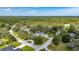 Expansive aerial view of a wooded homesite showcasing the pool, outdoor spaces, and lush surroundings at 11301 Donneymoor Dr, Riverview, FL 33569
