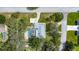 Aerial view of a property featuring a screened pool, patio, and mature trees at 11301 Donneymoor Dr, Riverview, FL 33569