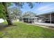 Expansive backyard showcasing a screened in pool area, ideal for outdoor relaxation and entertainment at 11301 Donneymoor Dr, Riverview, FL 33569