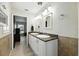 Bathroom featuring granite countertops and dual sinks at 11301 Donneymoor Dr, Riverview, FL 33569