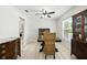 Dining room features wood table, woven chairs, and light wood-look floors at 11301 Donneymoor Dr, Riverview, FL 33569
