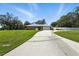 A brick home with a long driveway, well-maintained lawn, and an attached garage at 11301 Donneymoor Dr, Riverview, FL 33569