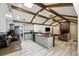 Modern kitchen features exposed wood beams, an eat-in bar, and stainless steel appliances at 11301 Donneymoor Dr, Riverview, FL 33569