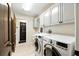 Bright laundry room with modern washer and dryer at 11301 Donneymoor Dr, Riverview, FL 33569