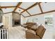 Cozy living room with brick fireplace and view of pool area through French doors at 11301 Donneymoor Dr, Riverview, FL 33569