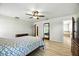 Spacious main bedroom featuring wood-look flooring and ensuite bathroom access at 11301 Donneymoor Dr, Riverview, FL 33569