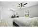 Bright main bedroom features luxury vinyl flooring, ceiling fans, and natural light from windows at 11301 Donneymoor Dr, Riverview, FL 33569