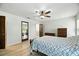 Spacious main bedroom featuring wood-look flooring and a ceiling fan at 11301 Donneymoor Dr, Riverview, FL 33569