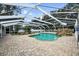 Screened pool area featuring stone details, providing a private retreat for swimming and relaxation at 11301 Donneymoor Dr, Riverview, FL 33569