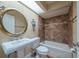 Bathroom featuring a large mirror, sink, toilet, and shower-tub combination at 11503 Robles Del Rio Pl, Temple Terrace, FL 33617