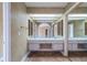 Well-lit bathroom featuring dual sinks, a mirrored wall, and tile flooring at 11503 Robles Del Rio Pl, Temple Terrace, FL 33617