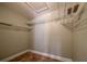 Walk-in closet with wire shelving and tiled floors at 11503 Robles Del Rio Pl, Temple Terrace, FL 33617