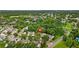 Aerial view of a residential neighborhood surrounded by lush greenery at 12336 Villager Ct, Tampa, FL 33625