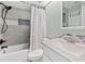 Modern bathroom featuring updated fixtures and a shower-tub combo at 12336 Villager Ct, Tampa, FL 33625