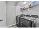 Convenient laundry room with modern appliances and ample storage space at 12336 Villager Ct, Tampa, FL 33625
